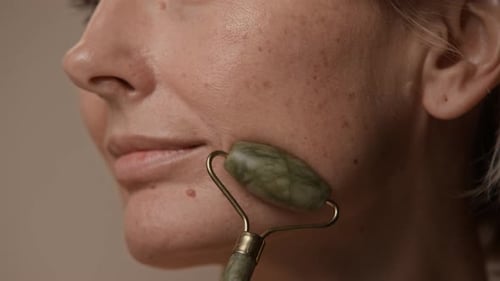 Jade Roller in Female Hand