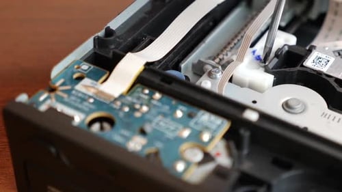 Close-up Hand Fastening Computer Screw with Screwdriver