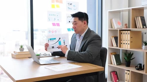 Man Presents Business Data During Video Conference