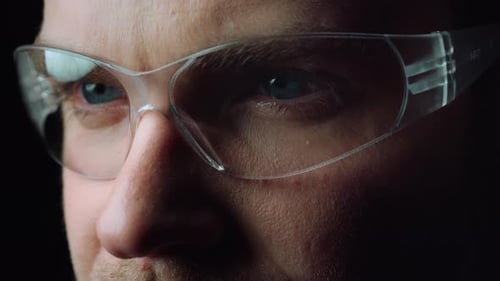 Man wearing safety glasses in extreme close up