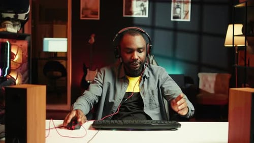 Enthusiastic Gamer Puts on Headphones to Play