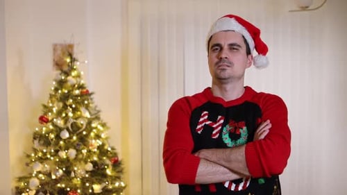 Man in Santa Hat with Christmas Tree