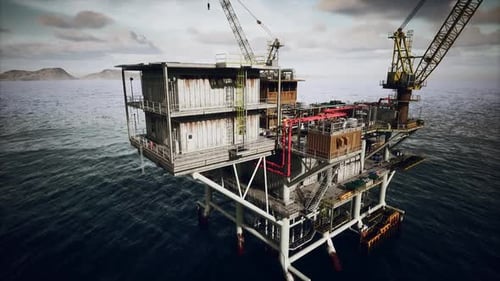 Large Crane Operating on Old Oil Rig Platform in Ocean