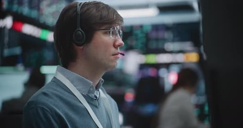Determined Young Specialist Deeply Engaged in Technical Analysis