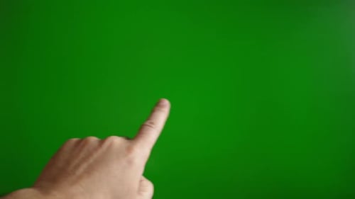 36. A man's hand on a green background scrolls up. Touch screen concept.