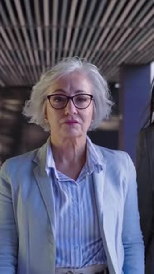 Empowered Businesswoman Walk Purposefully Into the Office Looking at the Camera Seriously