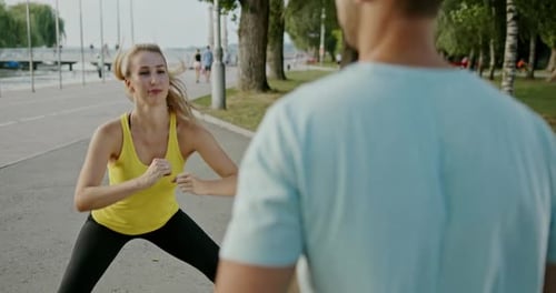 Woman Exercising Outdoors with Partner