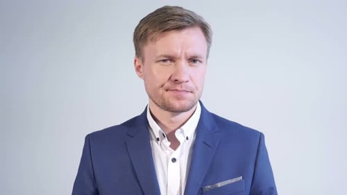 Man in Suit Close Up Against White Background