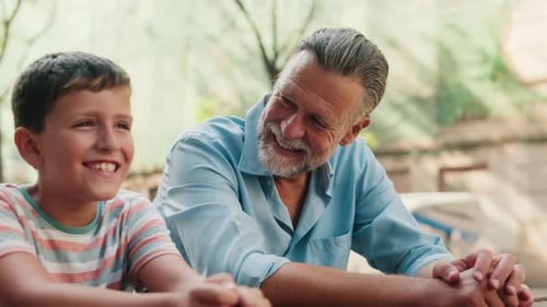 Grandfather and Grandson Sharing a Happy Moment Together