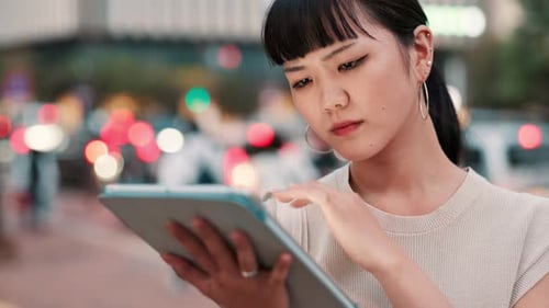 City, tablet and thinking with Japanese businesswoman outdoor for online planning