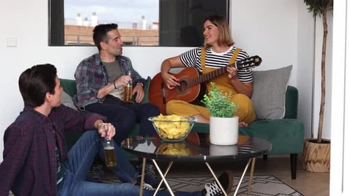 Friends Relaxing, Playing Guitar, and Drinking Beer