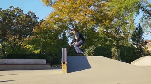 Skateboarder Performs Trick at Skate Park