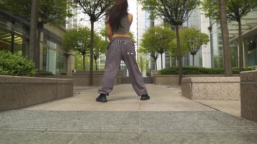 Woman Dancing in Urban Cityscape