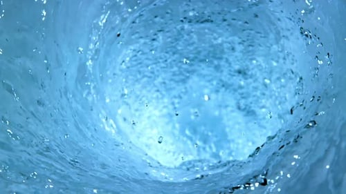 Swirling Pale Blue Water Forms a Vortex