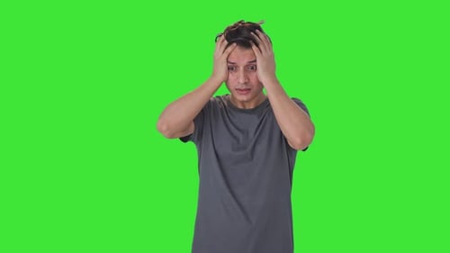 Indian man suffering from headache Green screen