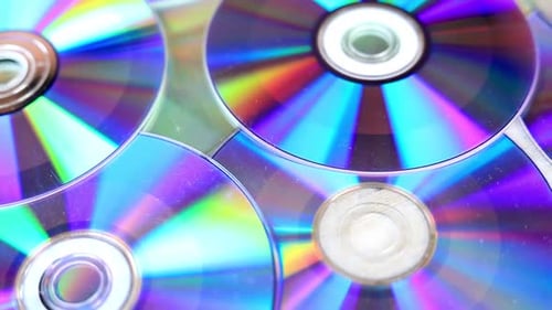 Closeup of Compact Disc. Pile of Archived CD cassettes.