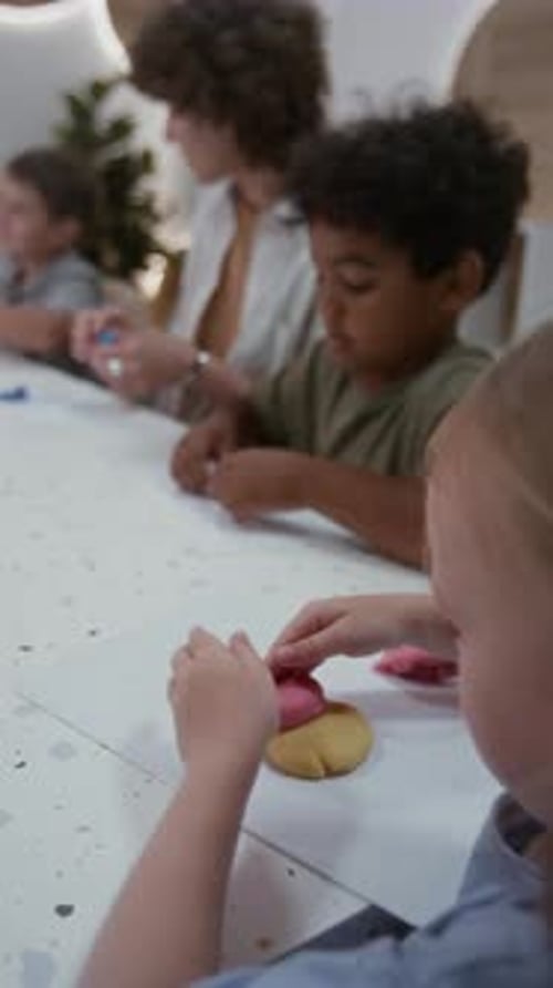 Children Making Art with Play Dough in Classroom