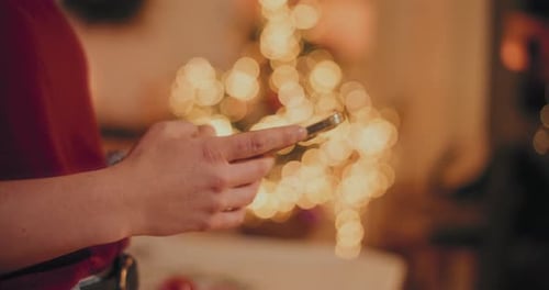 Portrait Of Woman Browsing Scrolling Smartphone Christmas Holidays