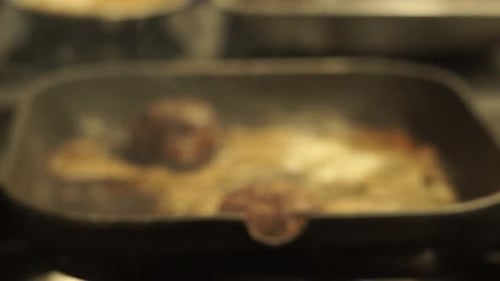 Burger Patties Fried In Pan. closeup, rack focus