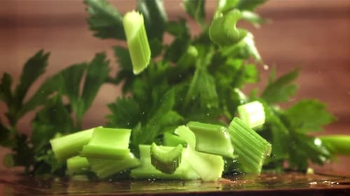 Pieces of Chopped Celery Fall on the Table Filmed on a Highspeed Camera at 1000 Fps