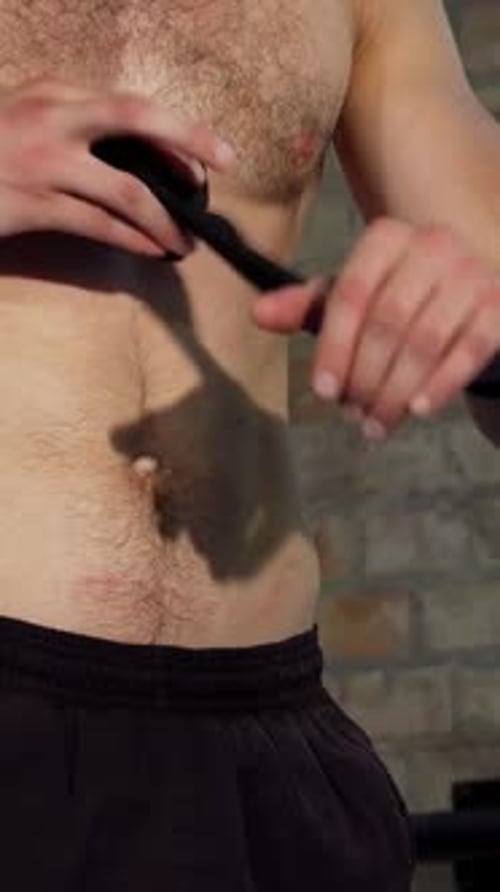 Man Wraps Arm in Gym for Workout