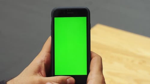 Man Using Vertical Smartphone with Green Screen Closeup Shot of Man's Hands with Mobile Phone Chroma