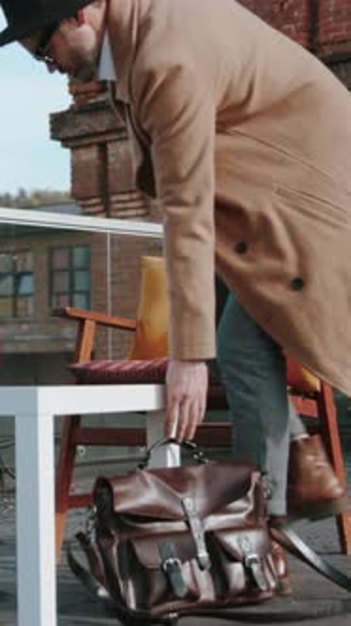 A Stylish and Comfortable Outdoor Seating Area Featuring Cozy Cushions and a Table