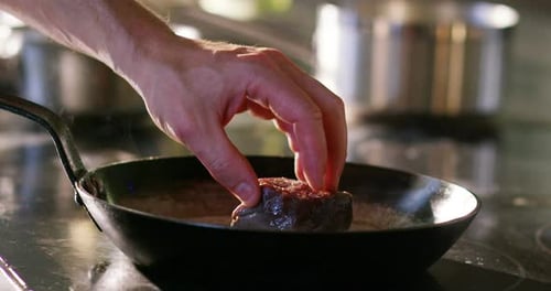 Preparing Meat in Skillet