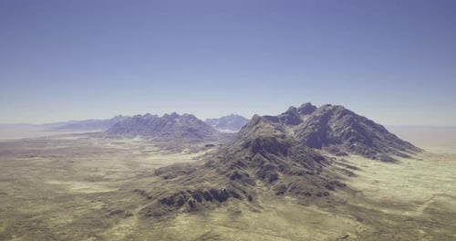 Breathtaking View of Rugged Mountains Under a Clear Sky in Arid Landscape