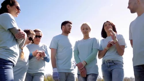 Volunteers Gather in a Park on a Sunny Day