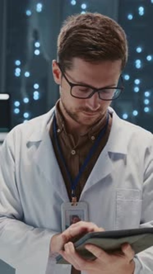 Data Center Portrait of Attractive Smart Bearded IT Technology Specialist with Digital Tablet