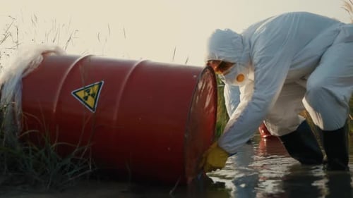 Scientists Inspecting Toxic Waste Barrels in Polluted Waters