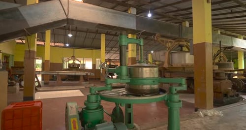 Tea factory interior with green processing and production equipment