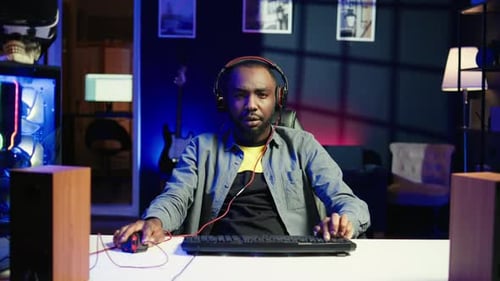 Excited Young Adult Gaming at Home