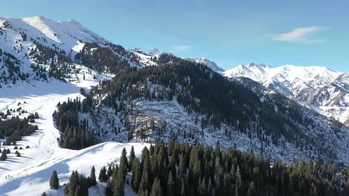 Snowy Mountain Range Aerial View on a Sunny Day