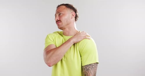 Fitness, shoulder pain and man in studio for workout accident, exercise and training injury