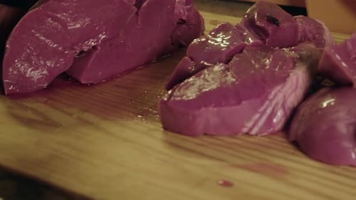 Liver being Cut into Cubes on Cutting Board