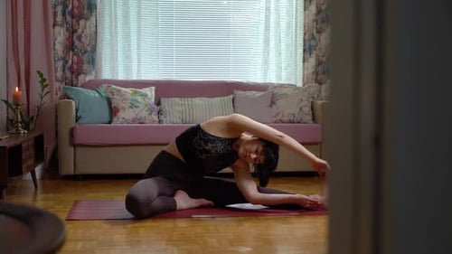 Woman Doing Yoga Stretch at Home