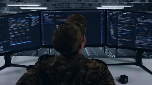 Back View Of Asian Military Having Backache While Write Code In Data Center