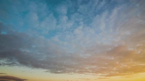 Time Lapse with Fast Moving Clouds on Blue Sky at Sunset