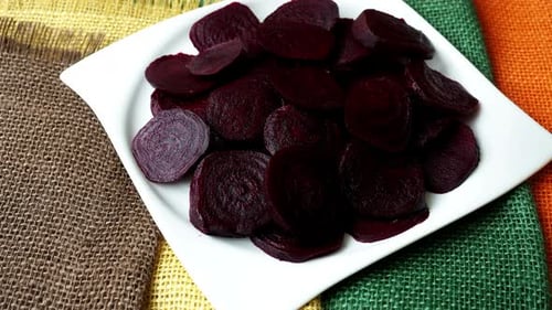 Beetroot chopped for salad in plate. Healthy ingredient for cooking. Cooked beet.