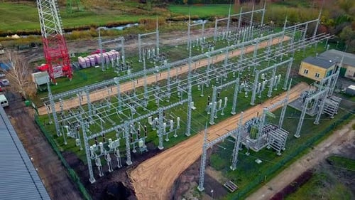 electricity power station outdoors. Aerial footage of high voltage power tower in a substation. Tran