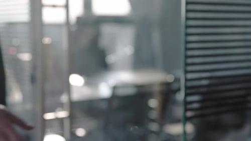 Businessmen shake hands in company office after successful marketing meeting