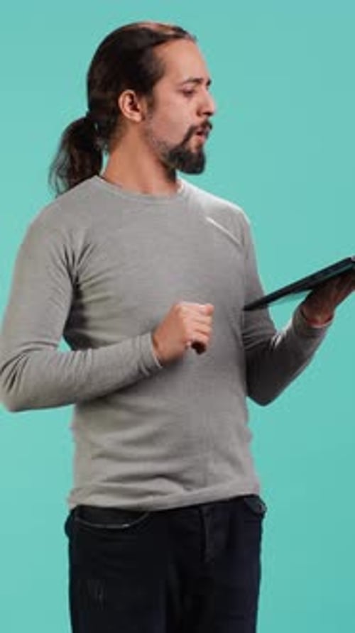 Vertical Video Man Composing Email Typing on Laptop Keyboard Excited to Log Off After Work