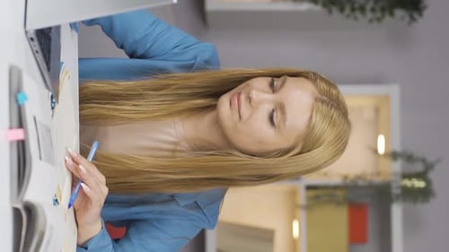 Young Woman Studying at Home Office Desk