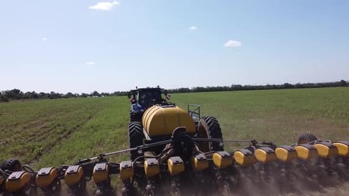 Blue Tractor O.A. Planting Canola On No Till Field