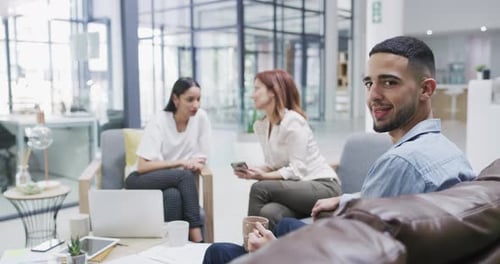 4k video footage of a confident young businessman having a team meeting in a modern office