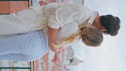 Embracing Lovers Contemplating Seascape at Town Vacation Vertical Back View