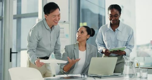 Business Team Collaborates on Laptop in Modern Office