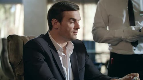 Businessman Paying by Smartphone in Restaurant. Business Man Using Mobile Phone For